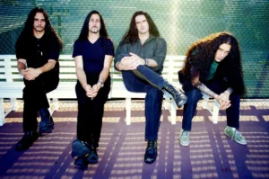 Type O Negative band members sitting on a bench.