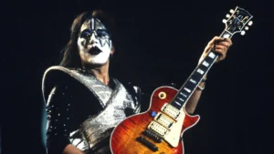 KISS band guitarist performing live on stage.